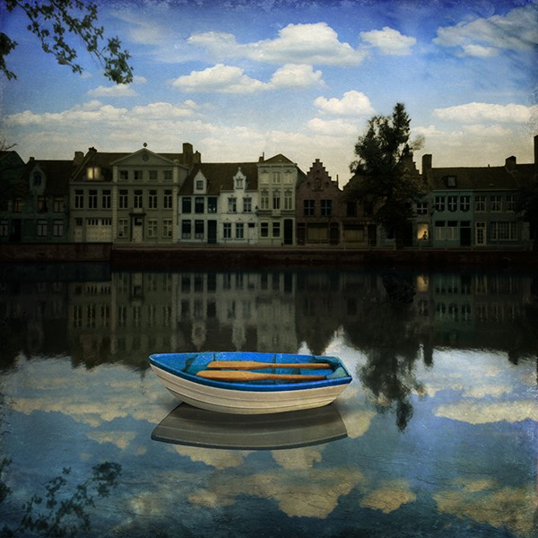 Photomontage by Maggie Taylor showing a small boat in a castle, it makes the viewer feel like being in a fairytale.